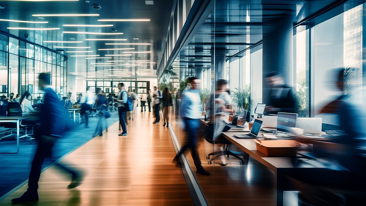 Bright business workplace with people in walking in blurred motion Bright business workplace with people in walking in blurred motion